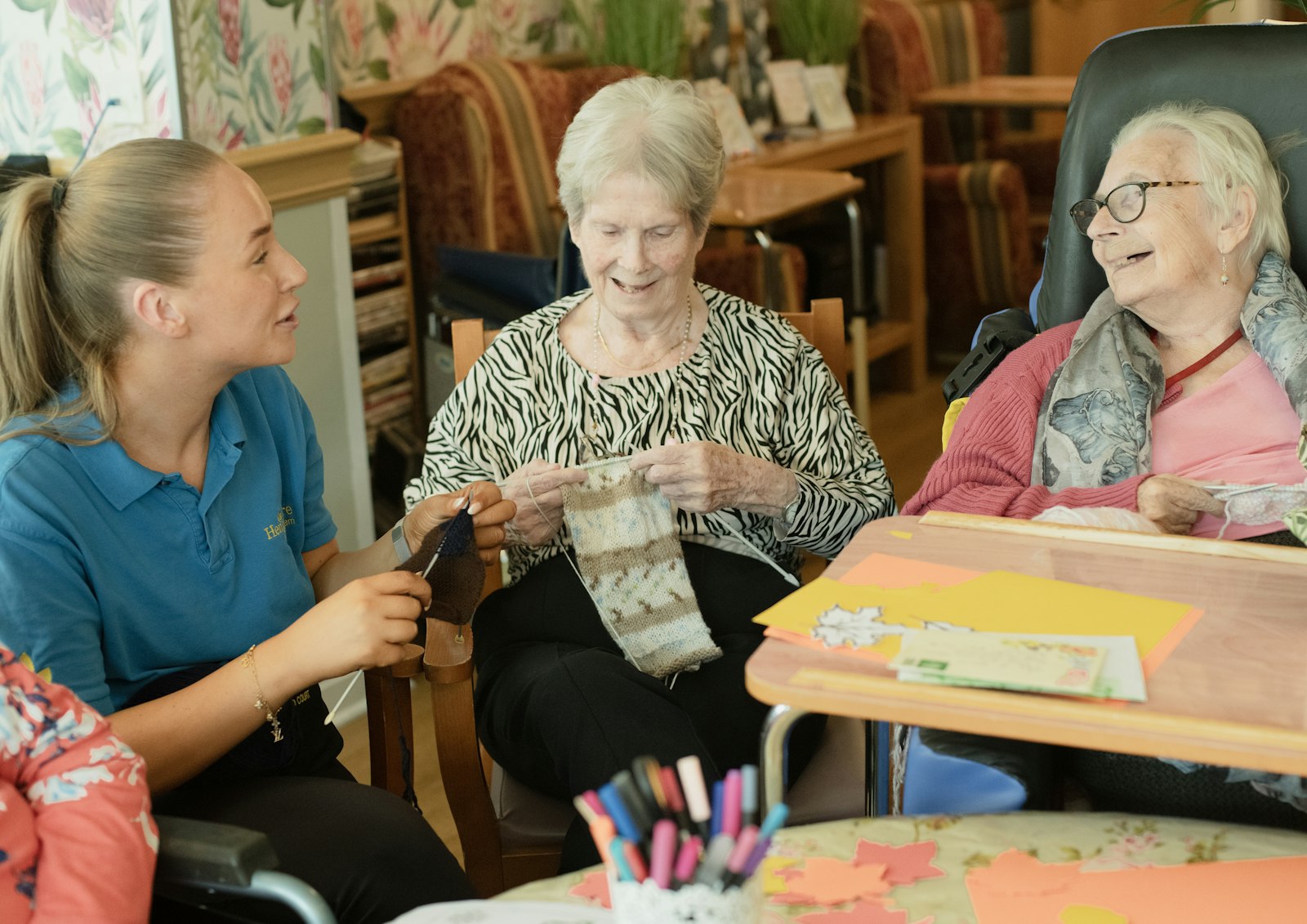 A caregiver sharing a warm moment with senior clients